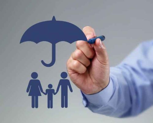 A symbol is being drawn with a blue marker showing an umbrella over a woman and man and child, signifying insurance coverage